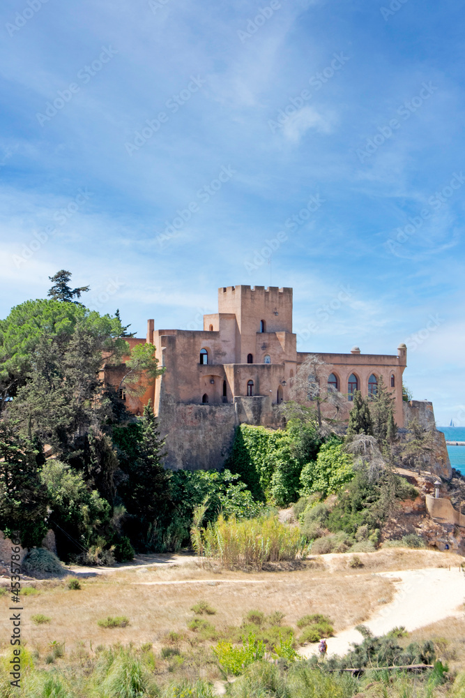 Medieval castle of Ferragudo, ancient fishing village of the Algarve, Portugal. Vertically