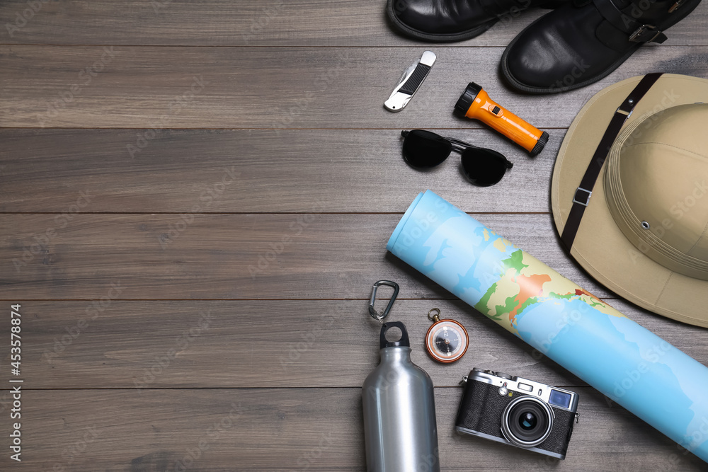 Flat lay composition with safari accessories on wooden background, space for text Flat lay composition with safari accessories on wooden background, space for text