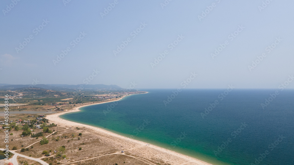 Panoramic drone clip of a small tropical peninsula in Strimonas, Macedonia, North Greece