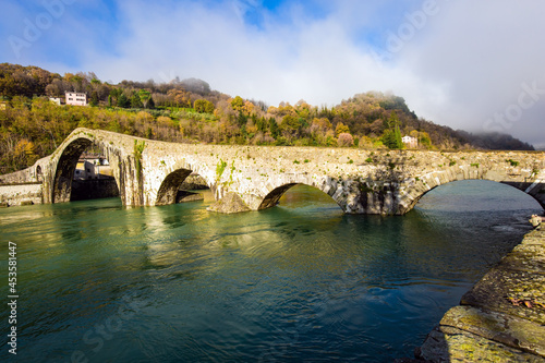 The bridge crosses the Serchio River.