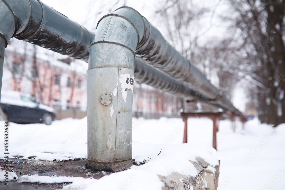 Gas pipe transite snow winter. Winter landscape with the snow-covered gas pipeline and trees in hoarfrost.