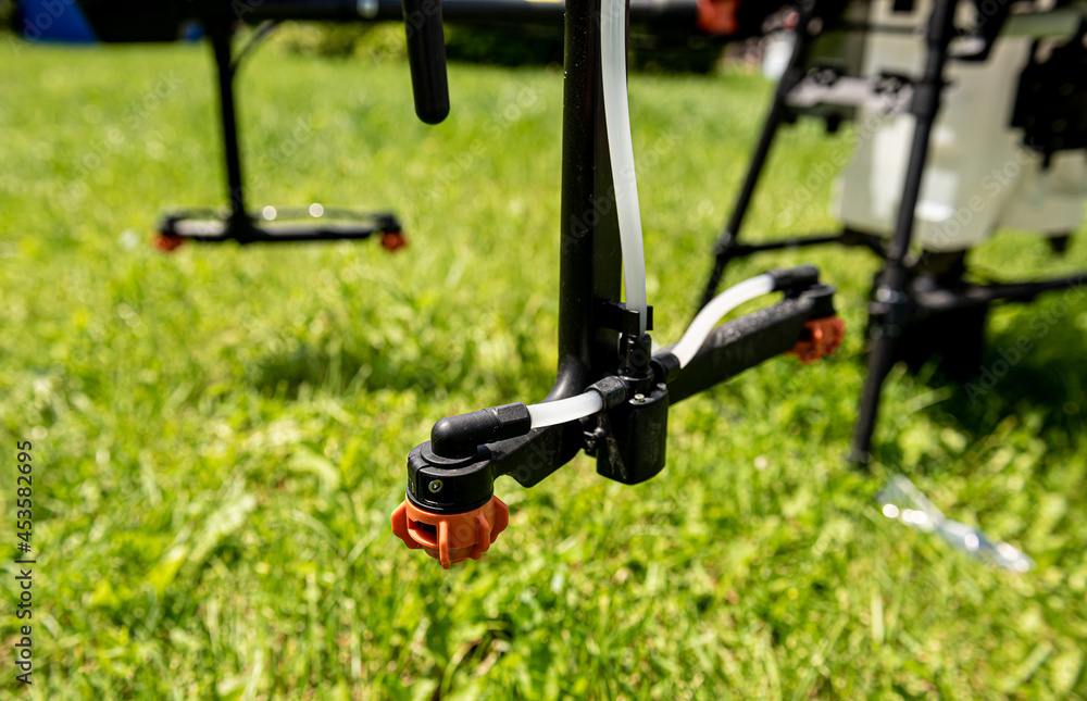 Professional agriculture drone on the green field Professional agriculture drone on the green field