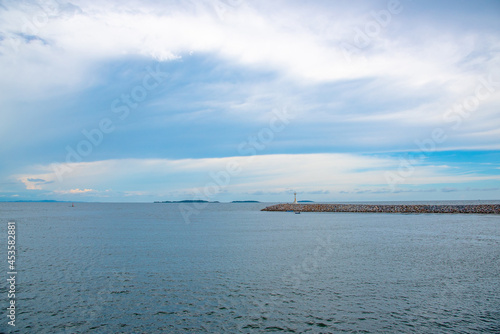 Nature in twilight period which including of sunrise over the sea and the nice beach. Summer beach with blue water and purple sky at the sunset. 