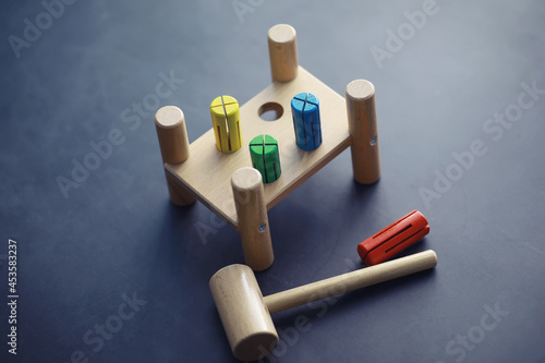 Children's development. Children's wooden toy on the table in the play area. Room of children's creativity and self-development. Wooden constructor.