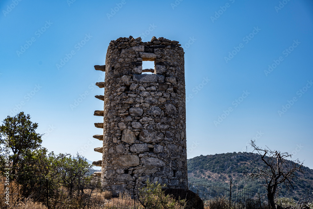 ancient stone mills and their ruins on the slopes of the mountains in Crete on a sunny day ancient stone mills and their ruins on the slopes of the mountains in Crete on a sunny day