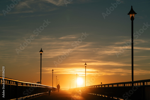 Amazing golden hour sun rays on a pier
