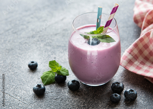 Glass of blueberry yogurt with blueberries