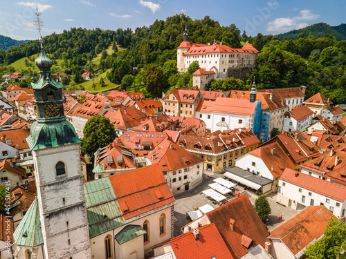 Skofja Loka in Slovenia. Medieval Old Town, Bell Tower and Castle. Drone View photo