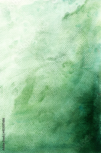 Green gradient watercolor texture on paper background in dark and light colors