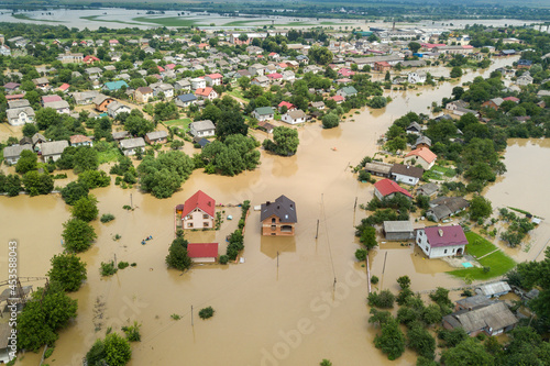 Aerial view of flooded houses with dirty water of Dnister river in Halych town, western Ukraine. photo
