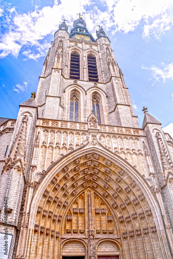 Kortrijk, West Flanders, Belgium - church tower and gothic portal