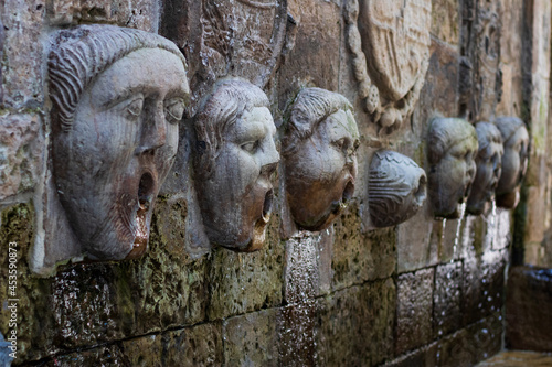 water fountain with heads in Aviles photo
