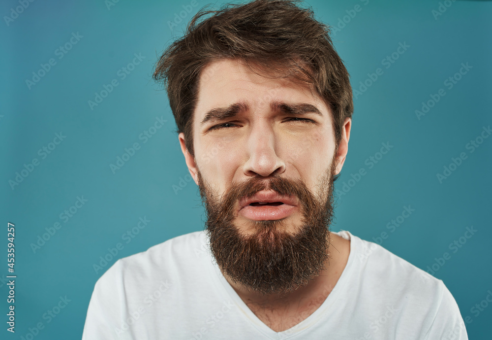 Fototapeta premium Man in a white t-shirt hand gestures anger Lifestyle