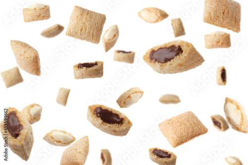 Quadro em tela Sweet crispy corn pads flying on white background