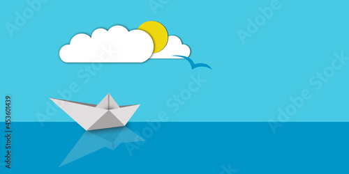 White Paper Boat on Blue Background