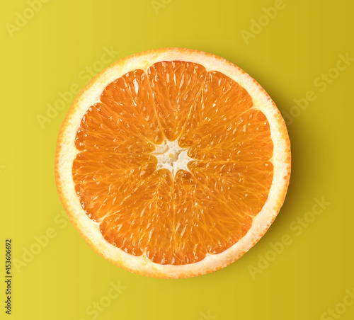 Orange slice isolated on yellow