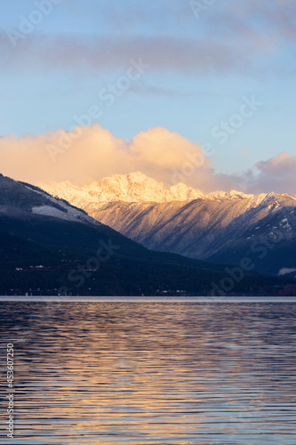Sunrise in the Pacific Northwest over the Olympic Mountains with fresh snow in the hills and early morning light