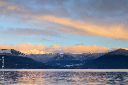 Sunrise in the Pacific Northwest over the Olympic Mountains with fresh snow in the hills and early morning light