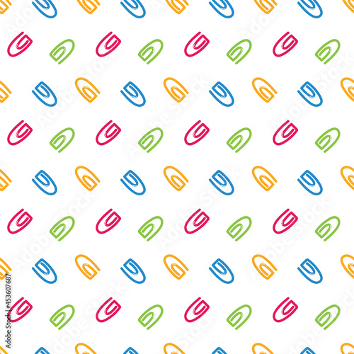 Colorful paperclips, office and school stationery vector seamless pattern background.

