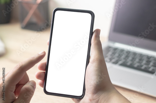 Wallpaper Mural Man's hands holding or using smartphone with two hands. Smartphone with white blank on screen, Cellphone mockup. Torontodigital.ca