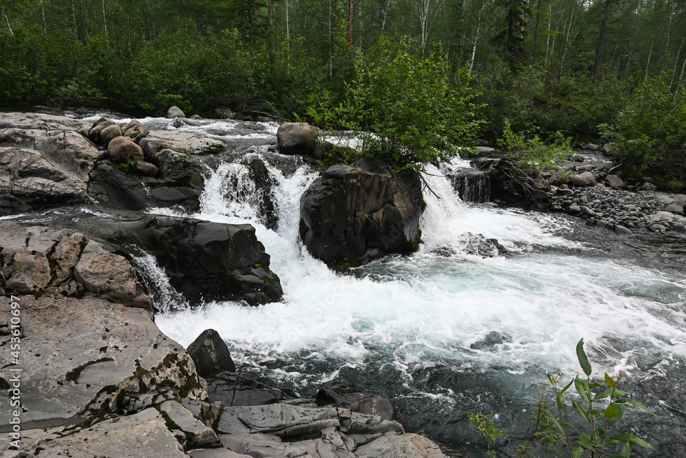 Putorana Plateau, a waterfall on the Grayling Stream. Putorana Plateau, a waterfall on the Grayling Stream.