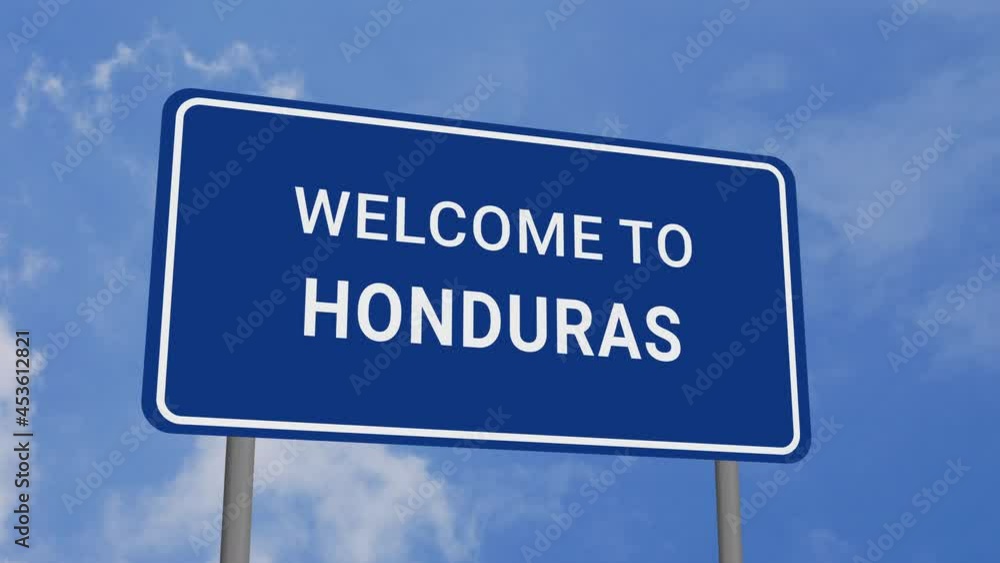 Welcome to Honduras Road Sign on Clear Blue Sky with Rapid Moving Clouds Welcome to Honduras Road Sign on Clear Blue Sky with Rapid Moving Clouds