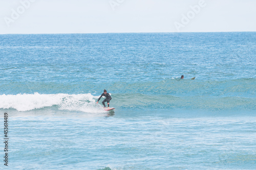 Surfer on a small left, les casernes beach, seignosse, landes, france