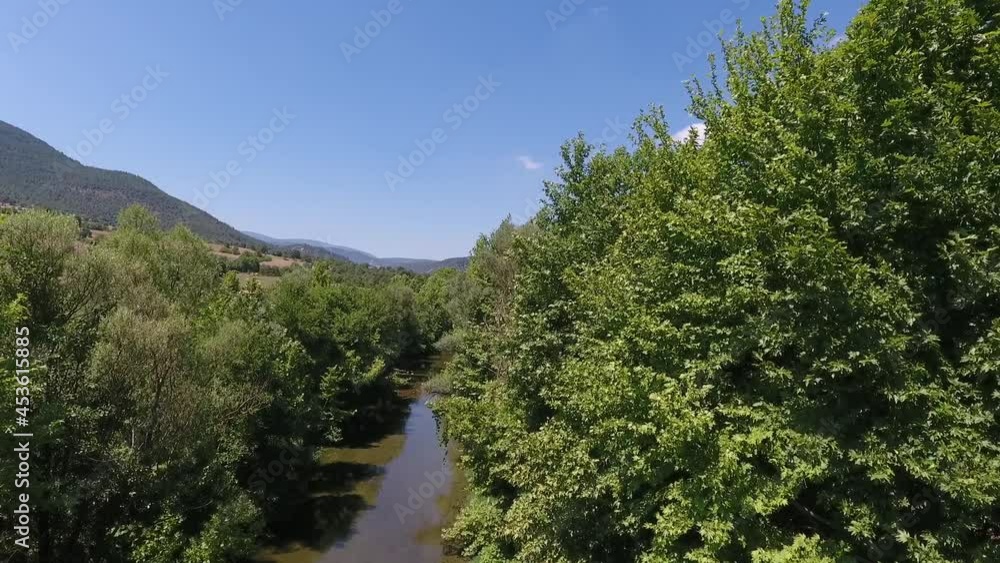 A river surrounded by trees. Flowing water. aerial view. Global warming. Agricultural irrigation canal. A river surrounded by trees. Flowing water. aerial view. Global warming. Agricultural irrigation canal.