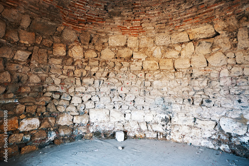 Interior stone wall of Sigacik castle in Turkey. Historical Seljukian architecture. photo