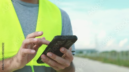 engineer working on his smartphone at the construction site