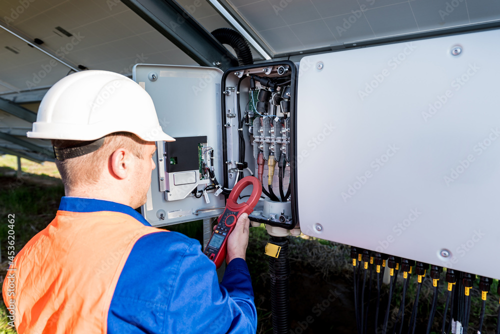 Fototapeta premium The inspector checks the actual output voltage level of inverter