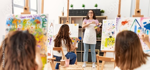 Group of women having paint class at art studio.
