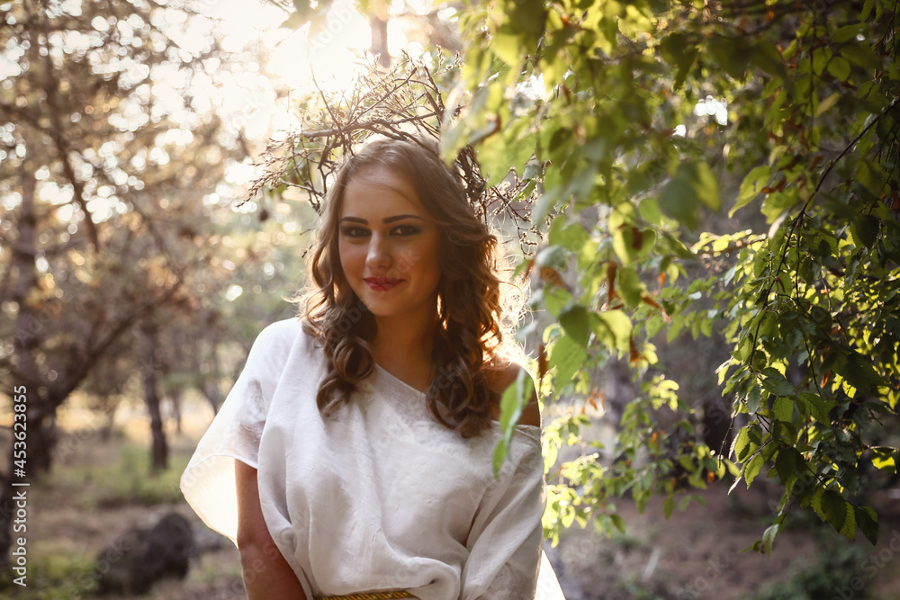 Beautiful mystery gothic woman in long white dress in autumn forest. Beautiful mystery gothic woman in long white dress in autumn forest.