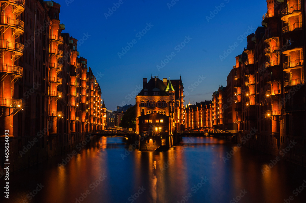 Speicherstadt Hamburg illuminated with river at night long exposure | Hamburg, Germany