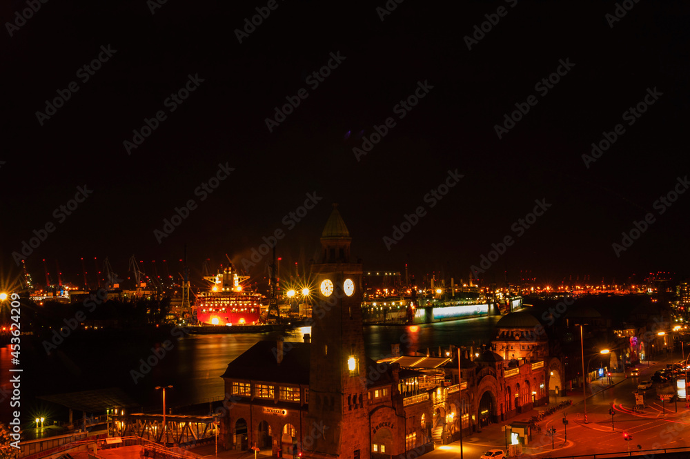 View over Hamburg (Landungsbrücken) with river elbe and cargo ship at night long exposure | Hamburg, Germany