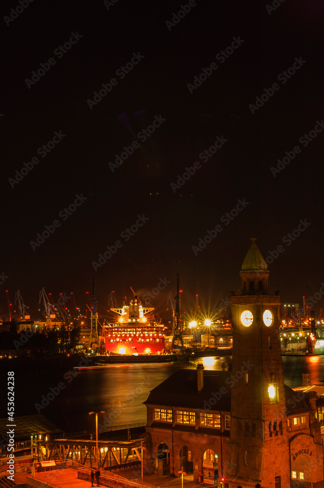 View over Hamburg (Landungsbrücken) with river elbe and cargo ship at night long exposure | Hamburg, Germany