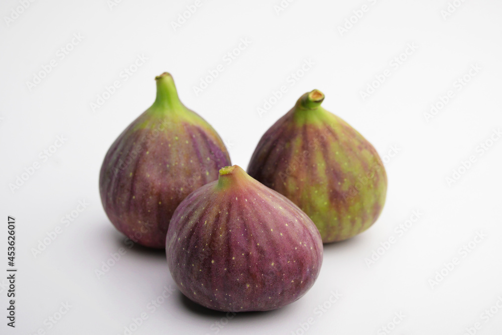 Isolated figs. Figs isolated on a white background with a clipping path. Purple fruit. Isolated figs. Figs isolated on a white background with a clipping path. Purple fruit.