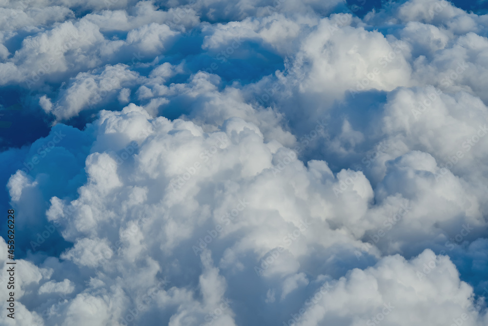 View of the sky above the clouds. blue sky high view from airplane window clouds shapes. sky-clouds background. Above the cloud View of the sky above the clouds. blue sky high view from airplane window clouds shapes. sky-clouds background. Above the cloud
