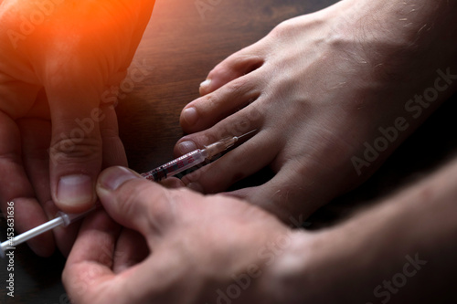 Man injecting himself on white background, closeup. Doping concept 