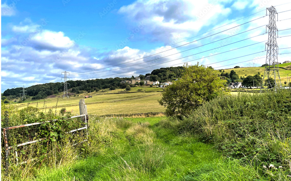 Rural scene near, Lee Lane, with fields, houses, and blue skies near, Bingley, Bradford, UK