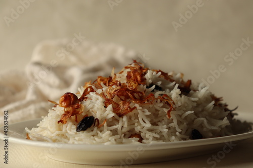 Rice dish made of Basmati rice, ghee and spices and garnished with fried onions and cashews. Commonly known as Ney choru in Kerala. photo