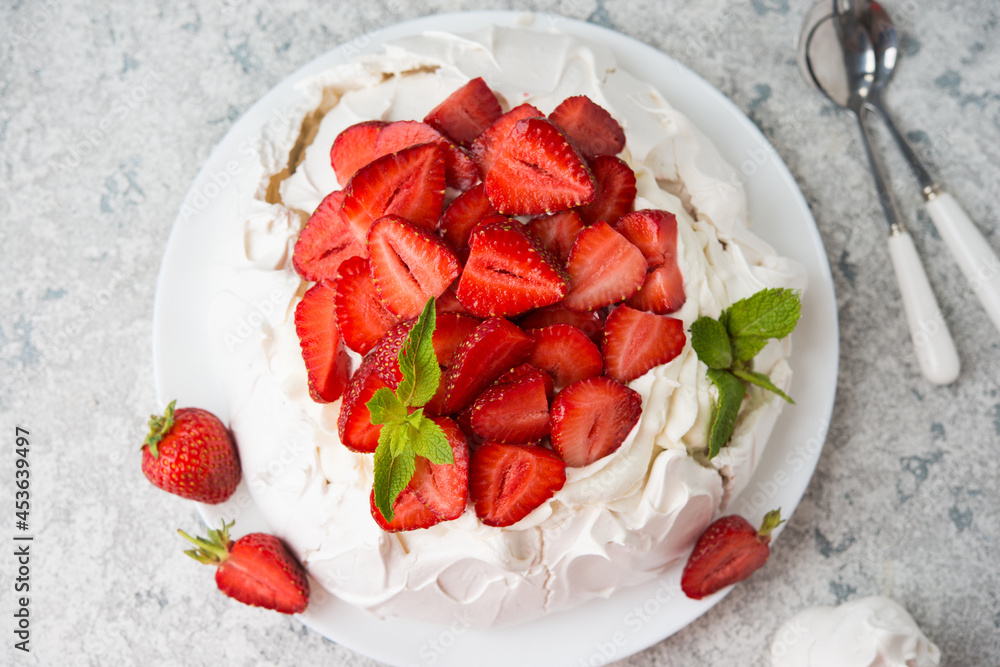 Pavlova cake with cream and strawberries, selective focus - obrazy, fototapety, plakaty 