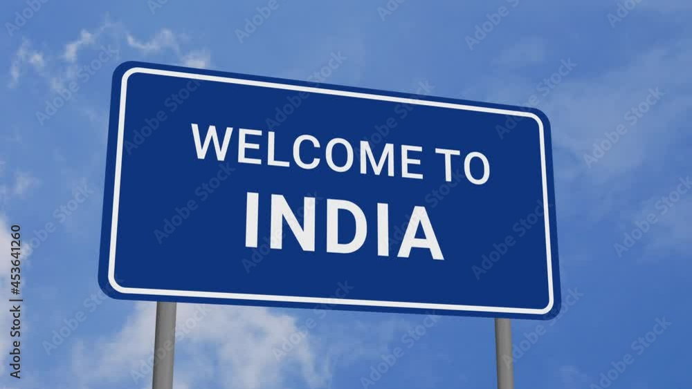 Welcome to India Road Sign on Clear Blue Sky with Rapid Moving Clouds Welcome to India Road Sign on Clear Blue Sky with Rapid Moving Clouds