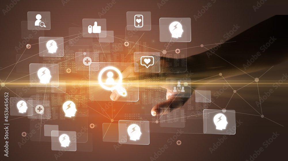 Hand pressing social media multimedia application screen with media icons on futuristic concept Hand pressing social media multimedia application screen with media icons on futuristic concept
