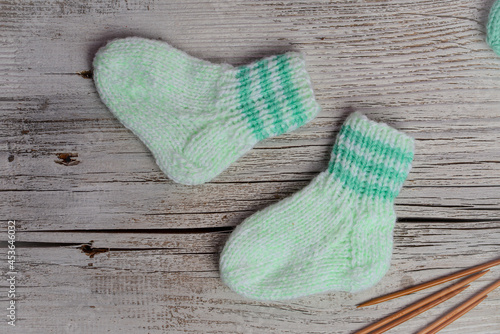 Mint color small newborn socks made of  soft cotton yarn