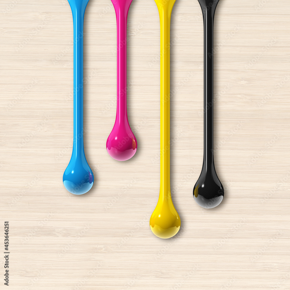 cmyk ink drops on beige wooden square background cmyk ink drops on beige wooden square background