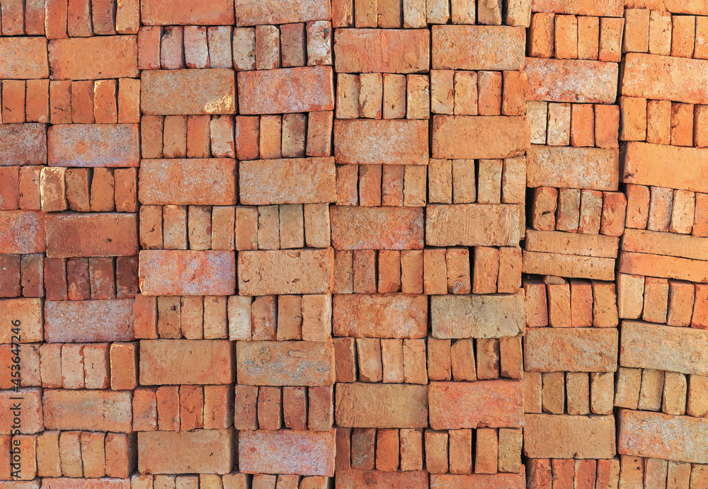 Fototapeta premium Traditional Red Bricks Stack near a Construction Site in India
