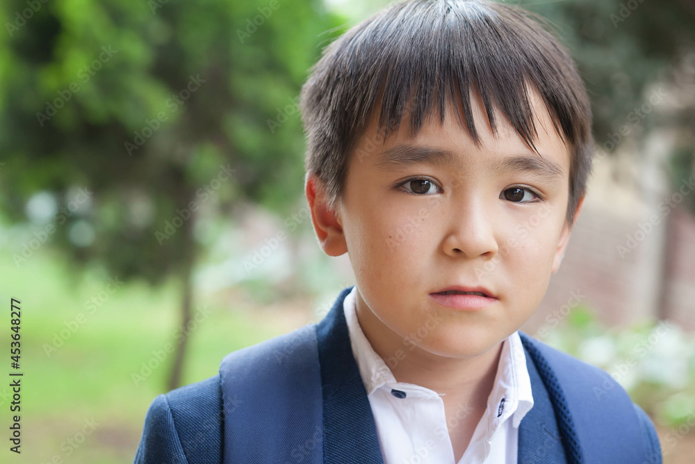 Happy cute asian school boy with books outdoors. Back to school Happy cute asian school boy with books outdoors. Back to school