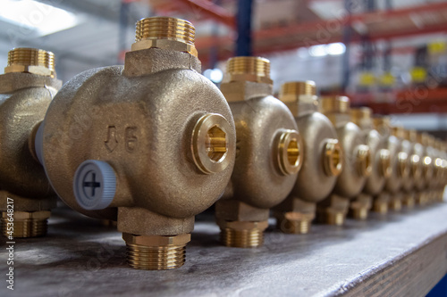 Close-up of new brass pressure reducing valves photo