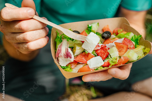 Photography Vegetable salad in the brown kraft paper food container